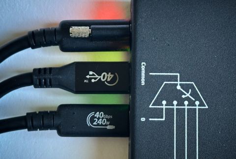 Image of 3 different types of USB-C cables plugged into an Acroname USB-C-Switch Pro.